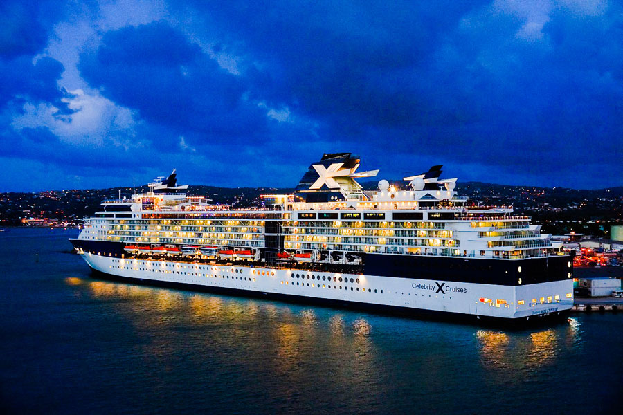 The Side View of a Cruise Ship With Lights Turned On