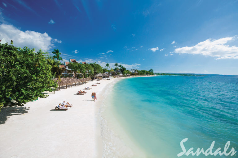 A White Sand Beach With Clear Water Waves