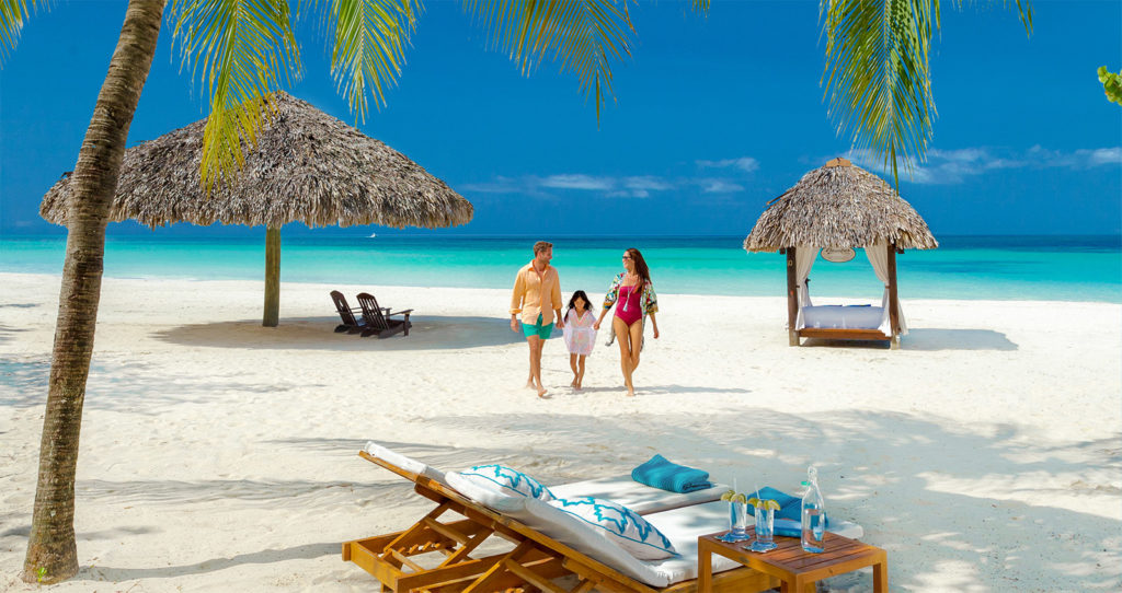 A Family Walking on the Beach Together