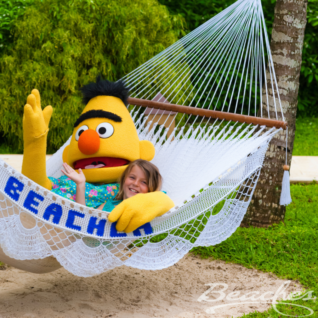 A Woman Lying With a Mascot on a Hammock