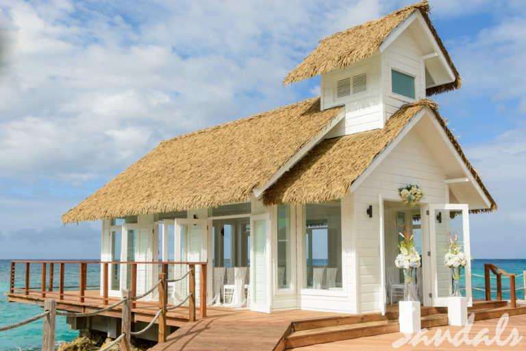 A House With White Body and a Hay Roof